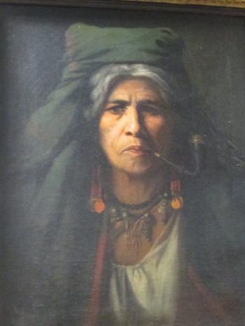Roma gypsy smoking a pipe, and wearing tribal jewellery by 
																	Adolf Mullner