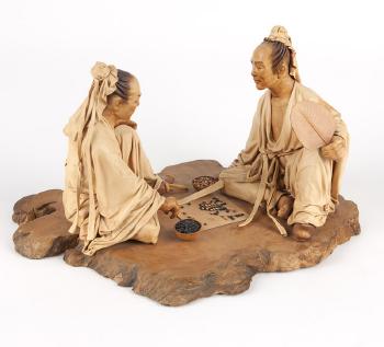 Two seated men playing Go by 
																			 Liu Miao Chan