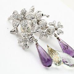 A pair of Flowers diamond ear clips by 
																			Ole Lynggaard