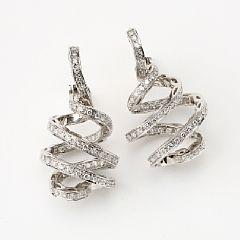 A pair of diamond ear pendant by 
																			 Damiani Co