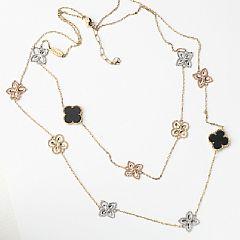 A two-strand onyx necklace set with carved flowers of onyx by 
																			Lorenzo Ungari