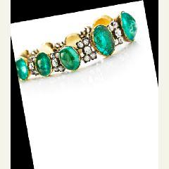 A emerald and diamond bracelet set by 
																			 Hancocks & Co.