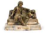 Beethoven sitting on a stone bench by 
																	T Curts