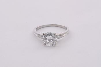 A brilliant solitaire ring by 
																	 Rene Kern