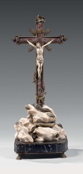 Crucifix agrémenté de palmes et agrafes rocailles reposant sur un tertre animé d’un serpent et de feuillages by 
																	Giuseppe Valadier