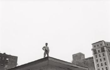Untitled (boy on rooftop) by 
																			Simpson Kalisher