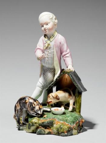 A Höchst model of a boy by a dog kennel by 
																	 Hochst Porcelain