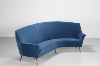 Curved sofa by 
																			Gigi Radice