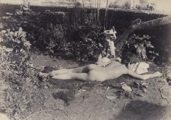 Nude reclining boy in garden by 
																	Guglielmo Pluschow