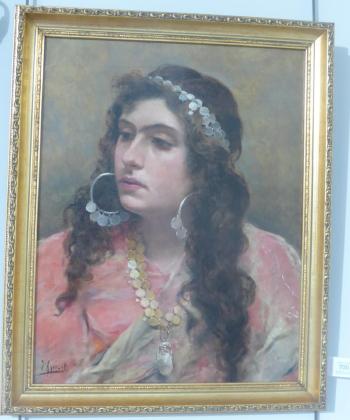 A Gypsy lady, head and shoulders by 
																			Joaquim Agrasot y Juan