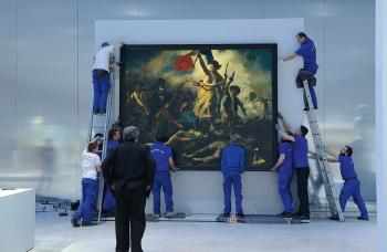 Au musée du Louvre-Lens, accrochage du tableau
'La Liberté guidant le peuple', d’Eugène Delacroix... by 
																	Hubert Fanthomme