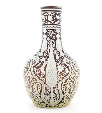 A Vase by 
																			George and Thomas Woodall