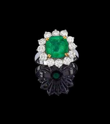 A René Kern brilliant and emerald ring by 
																	 Rene Kern