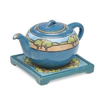 Rare teapot and trivet decorated in cuerda seca  with trees by 
																			Sara Galner