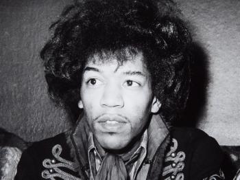 Jimi Hendrix Holding a Press Conference by 
																			Gunter Zint