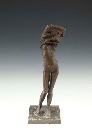 A figure of a Standing Female Undressing by 
																			David Backhouse