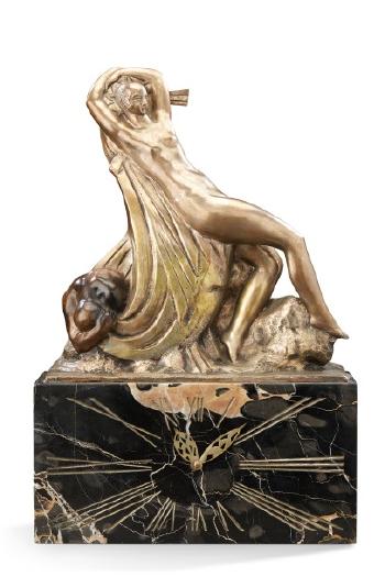 Pendule figurant une femme nue étendue by 
																	Raoul Lamourdeieu