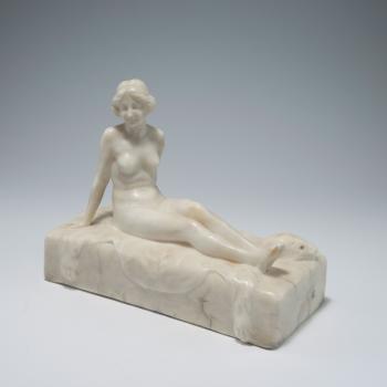 Female nude reclining on tiger skin rug by 
																			Fritz Kochendorfer