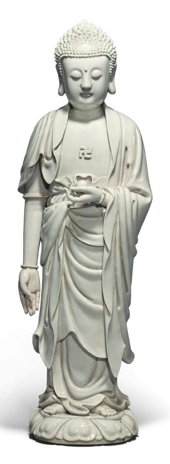 A 'Dehua' figure of Buddha by 
																	 Xu Youyi