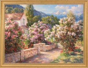 Flowering shrubs and stone wall with distant mountains by 
																	Sharon Engelstein