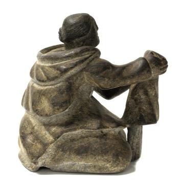 Woman Stretching a Kamik by 
																			Johnny Qarganaarjuk Okituk