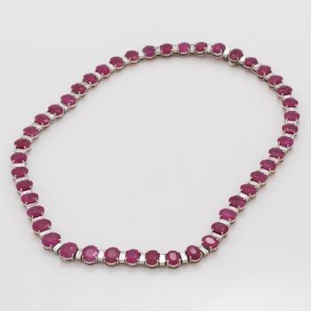 A ruby and baguette cut diamond rivière necklace by 
																			 Demner New York