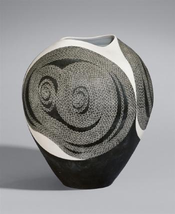 A large ovoid vase with impressed stylised flowers spiraling in gray-glazed areas by 
																			Kuwahara Odake
