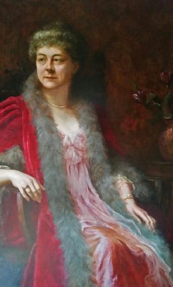 Portrait of a lady, seated, wearing a red gown with fur trim by 
																	Estella Louisa Michaela Canziani