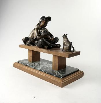 Boy sitting on walnut bench with two dogs and a cat by 
																			George W Lundeen