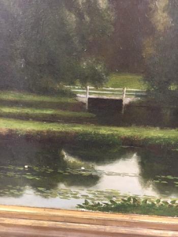 Landscape with lily pond and bridge by 
																			Edward M Bannister