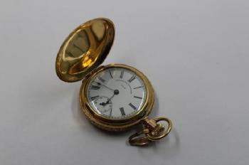 Gold Hunter case pocket by 
																			 Waltham Watch Company