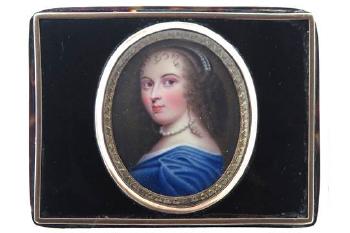 Portrait of a lady holding a portrait miniature by 
																	George Henry Harlow