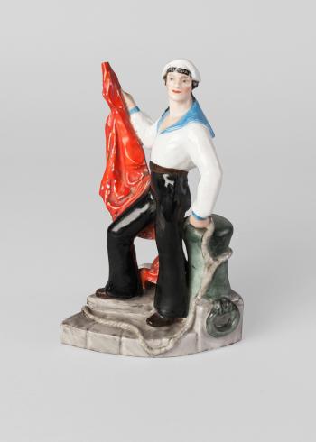 Soviet figure of a sailor with a red banner by 
																			Natalia Danko