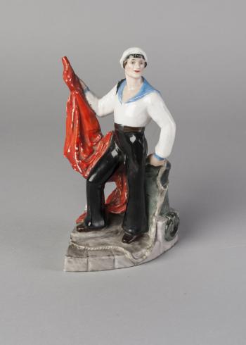 Soviet figure of a sailor with a red banner by 
																			Natalia Danko