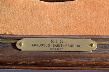 Circular portrait plaque by 
																			Augustus Saint-Gaudens