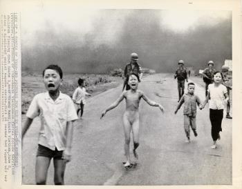 Children fleeing napalm attack, South Vietnam by 
																	Nick Ut
