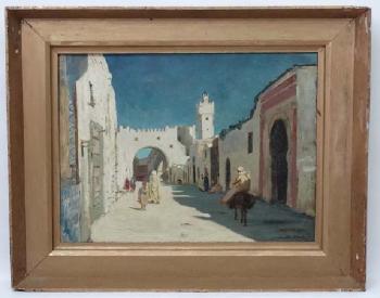 An Arab street scene with figures entering the Casbah (Citadel) by 
																			Auguste J F Legras