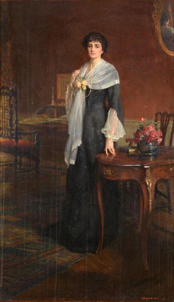 Mrs Arthur Heygate standing in an interior by 
																	George Percy Jacomb-Hood