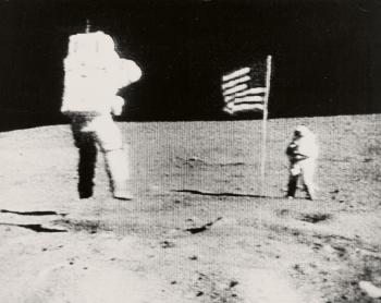 Apollo 16 TV Picture - Astronaut John W. Young leaps from the lunar surface as he salutes the U.S. flag by 
																	 NASA