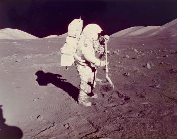Apollo 17 Scientist-Astronaut Harrison H. Schmitt collects lunar rake samples at Station 1 by 
																	 NASA