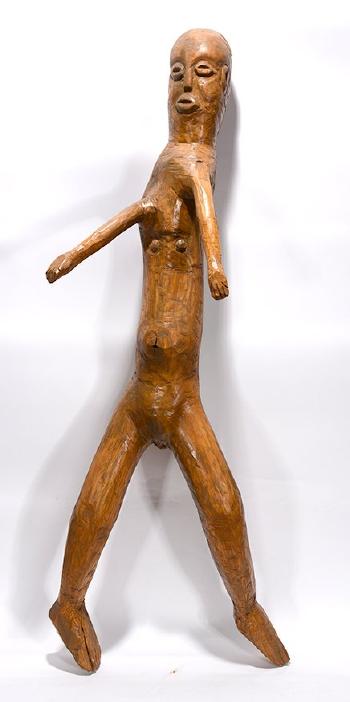 Large wooden figure by 
																			Raymond Coins