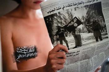 Reading the news by 
																	Ammar Abd Rabbo