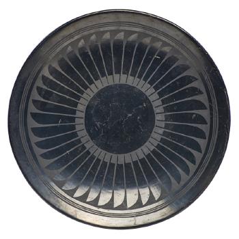 Blackware plate with negative feather motif by 
																	 San Ildefonso