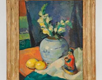 Floral still life with Lemons, Ginger jar and oriental figurine by 
																			Maurice Compris