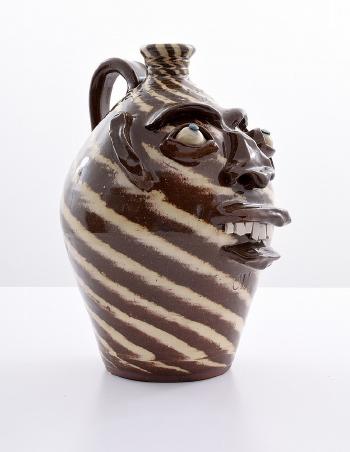 Folk art grotesque face jug by 
																			Charles Lisk