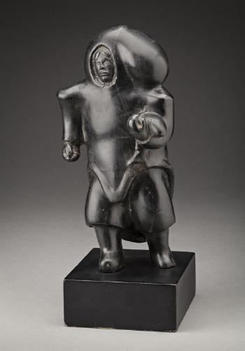 Mother Carrying a Child, Holding a Fish by 
																			Vital Makpaaq