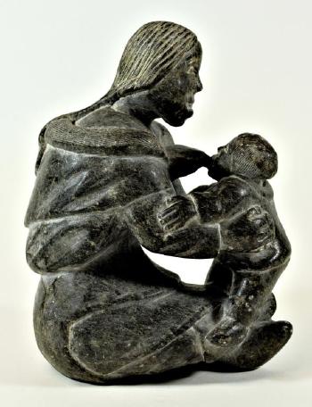 Mother Nursing a Child by 
																			Audlaluk Kupirkrualuk