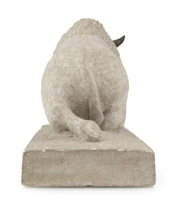 A carved Indiana limestone sculpture by 
																			Bob Haozous