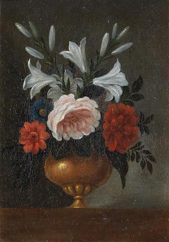 Lilies, peonies, a rose and other flowers in a gilt vase on a table-top by 
																	Pedro de Camprobin