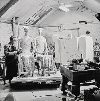 Henry Moore in his studio at much Hadham, Hertfordshire, working on King and Queen by 
																	Elsbeth Jay Juda